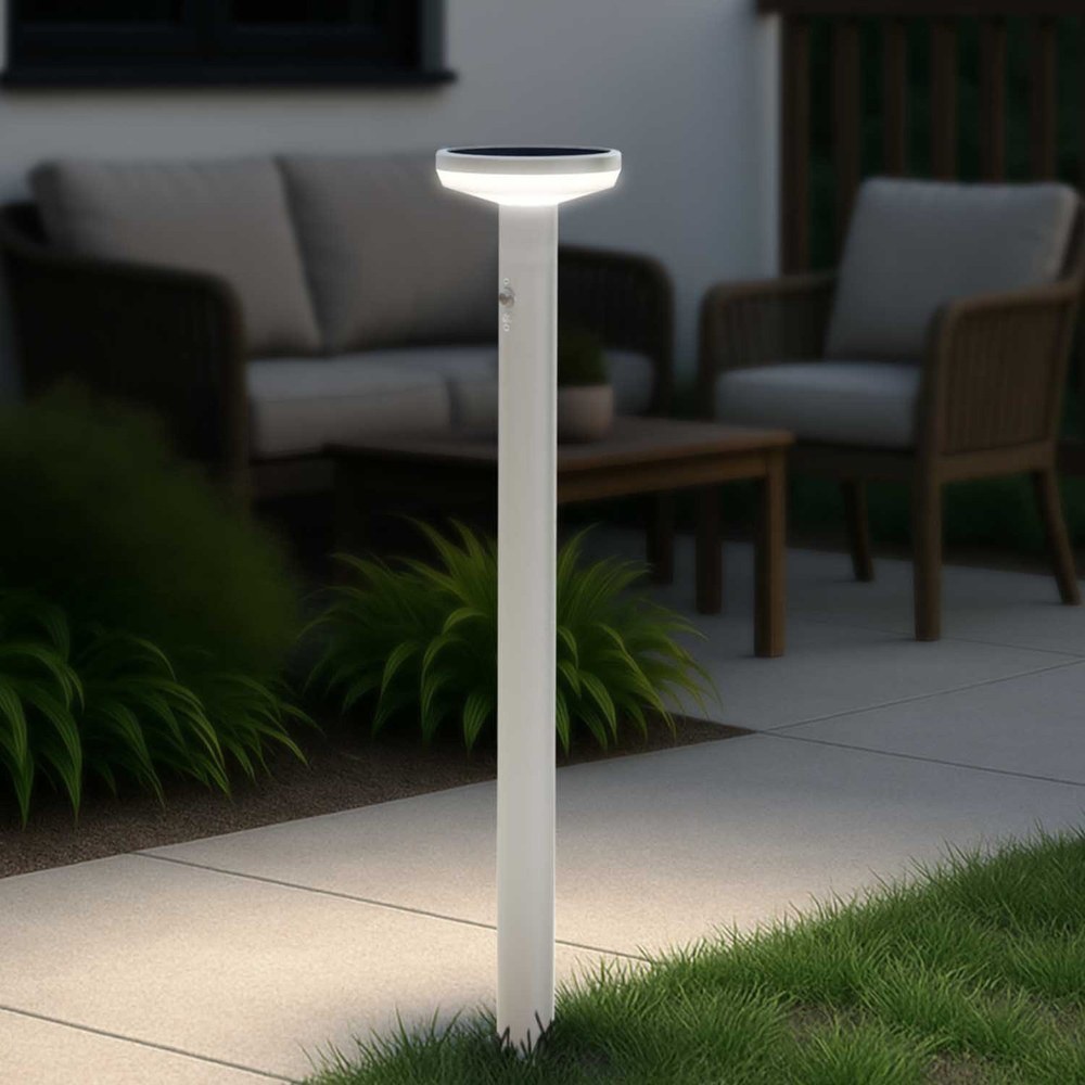 Ring Solar Pathlight stake light glowing on a walkway
